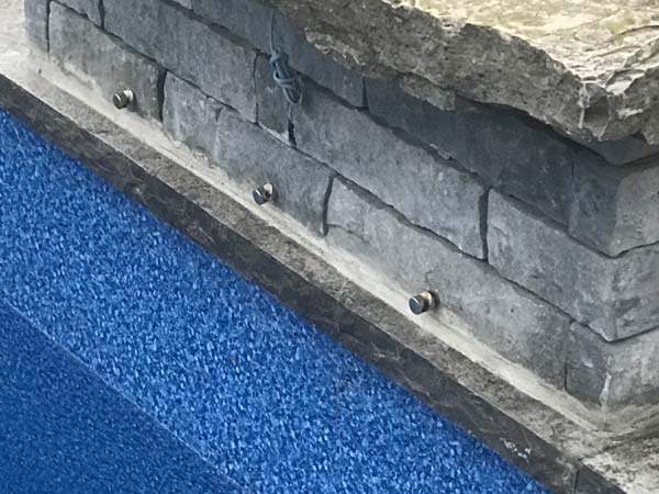 D loop anchors installed on a waterfall obstruction.